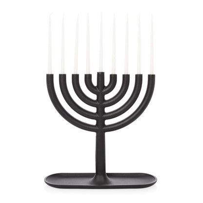 Black cast iron menorah and tiny taper candles
